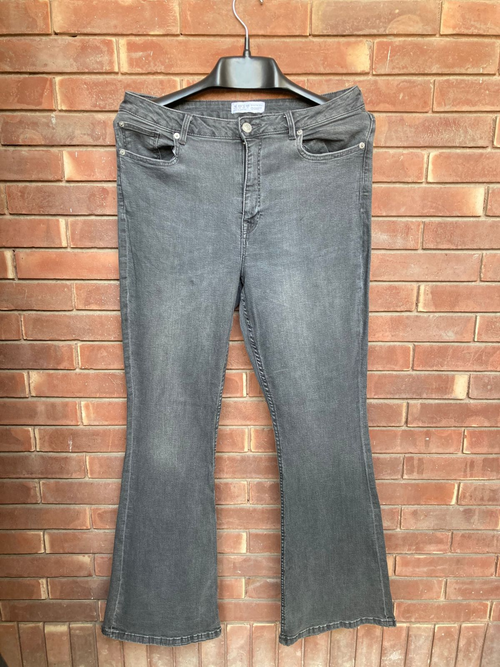 Original photo of charcoal grey flared jeans
