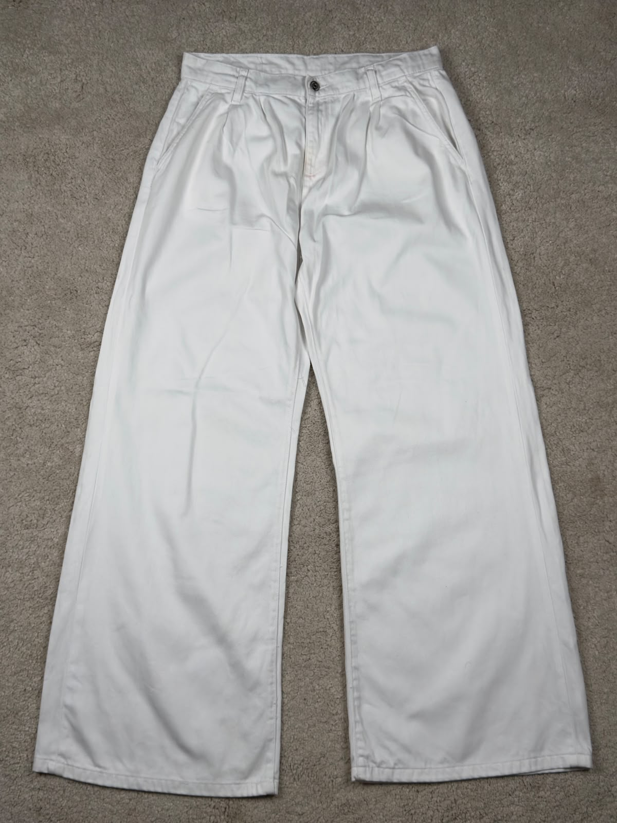 White pleated wide-leg trousers, front view