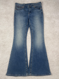 Washed black flared jeans, front view