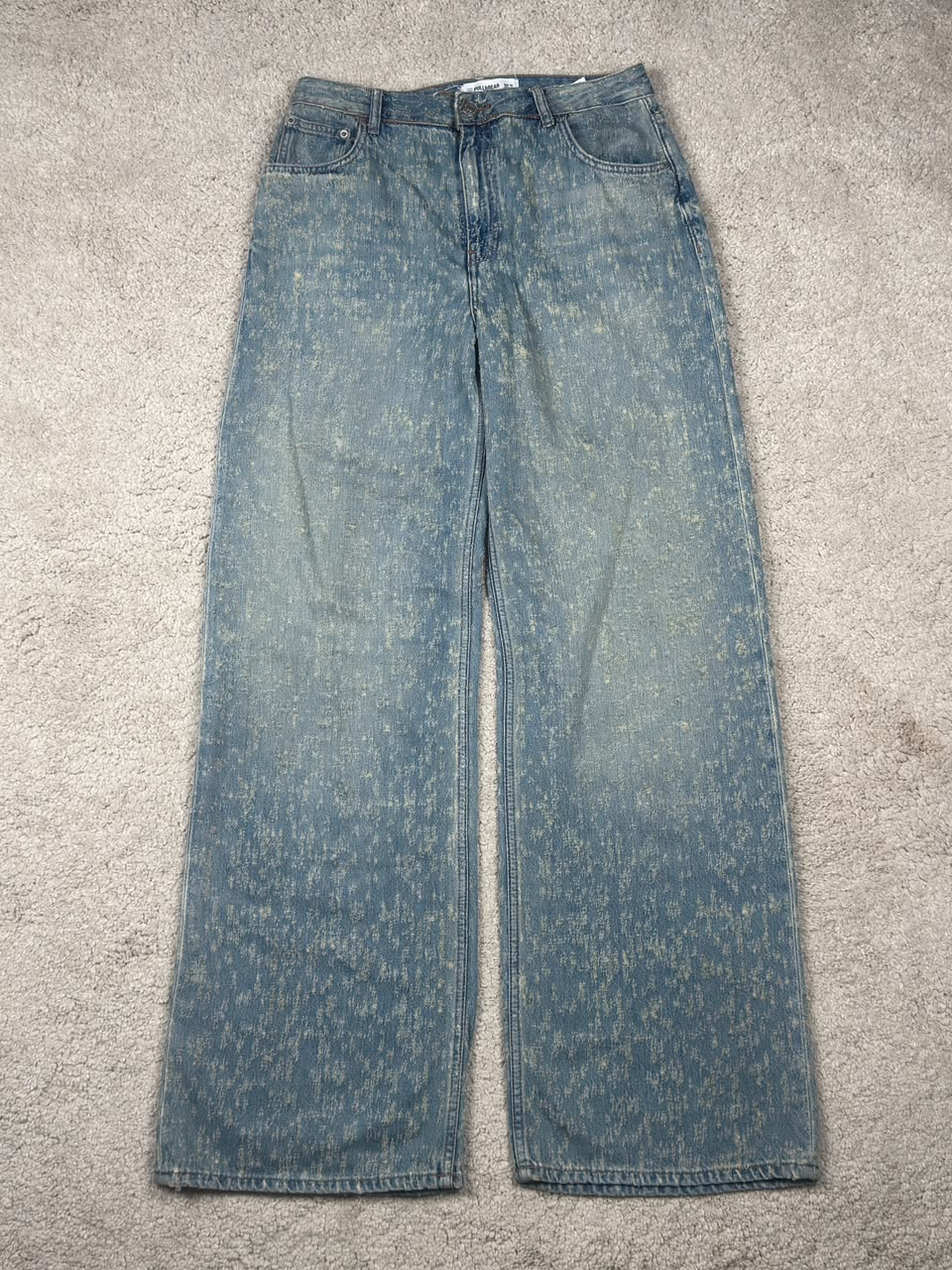 Pull&Bear light blue speckled wide-leg jeans, front view