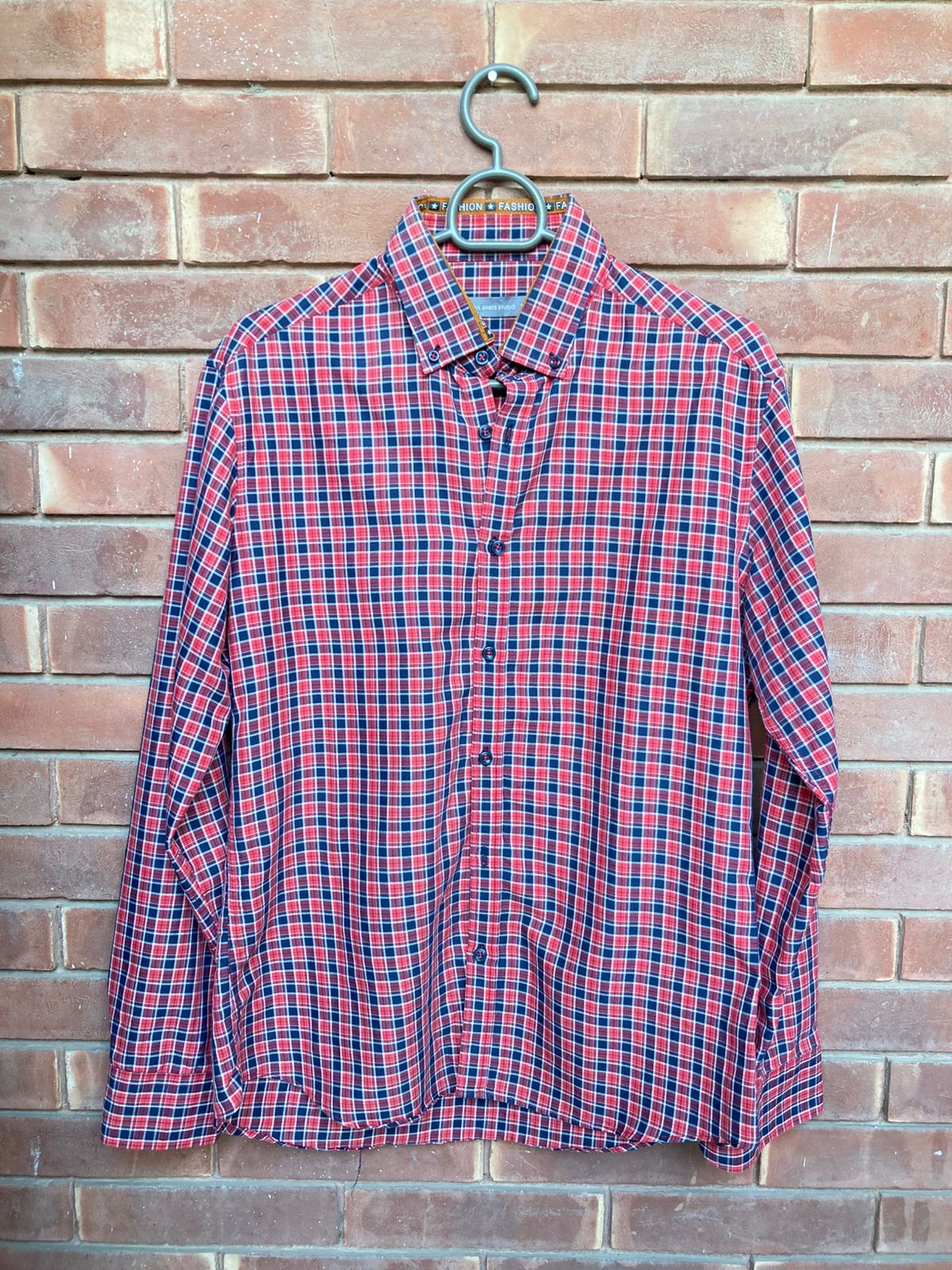 Original condition photo of red, navy and white check long-sleeve shirt