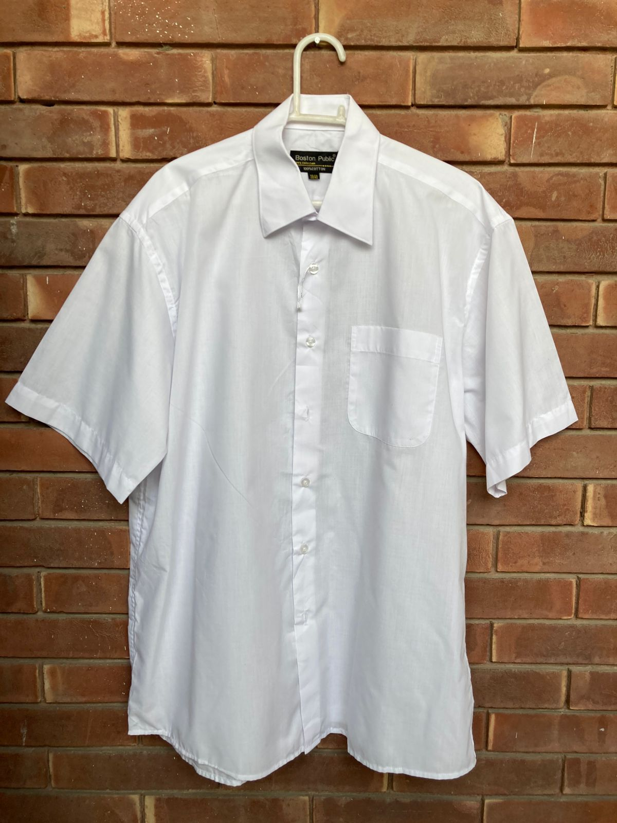 Original condition photo of Boston Public white short-sleeve shirt